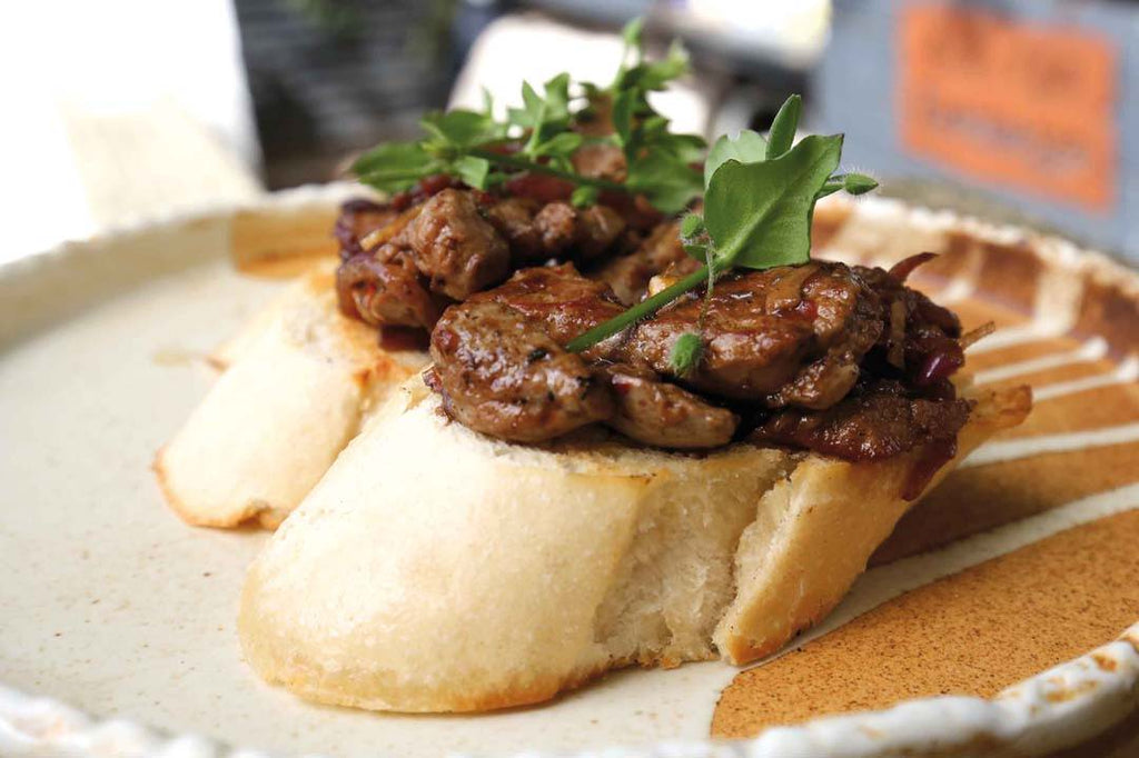 Glazed rabbit liver from the plancha plate on crostini with chickweed 